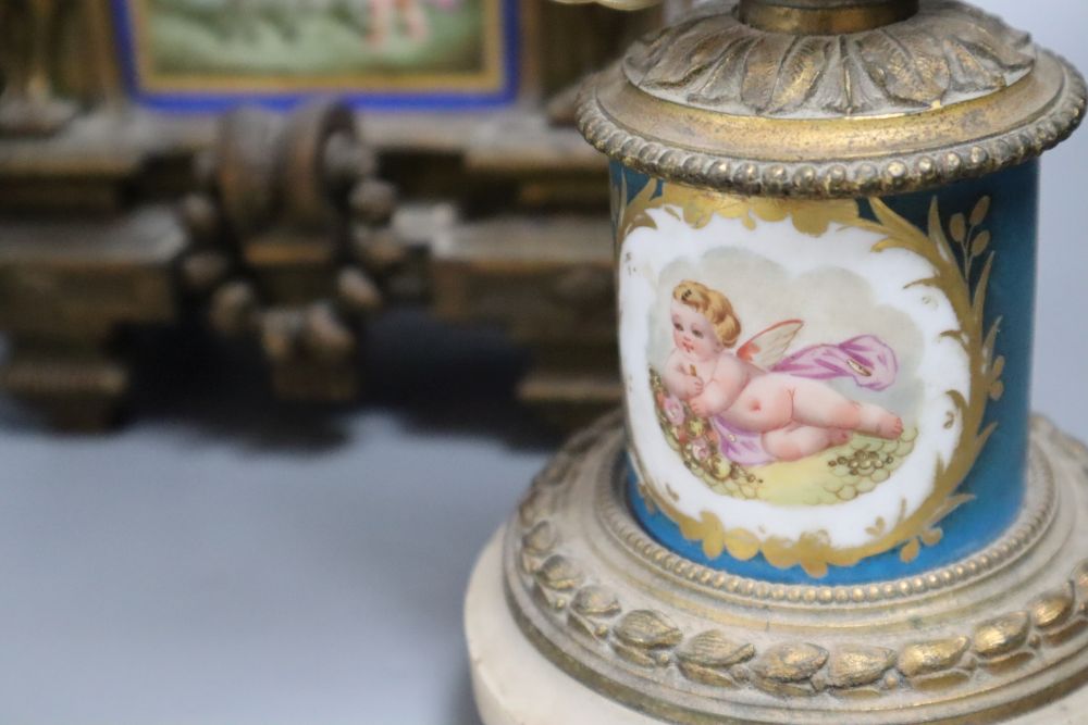 A 19th century French ormolu and Sèvres style porcelain matched garniture de cheminée